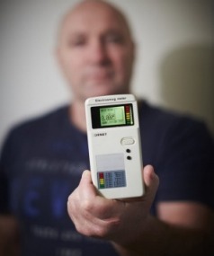 Bruce Evans with his smartphone-sized digital meter.